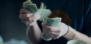 counting dollar banknotes